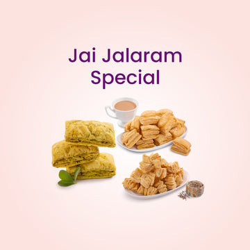 Jai Jalaram Special with traditional Indian sweets and a cup of tea on a light pink background